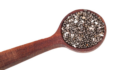 portion of Chia seeds in wooden spoon isolated
