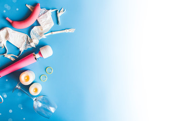 Pink vibrator on blue background