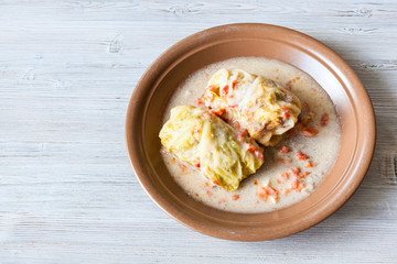 top view of stewed cabbage rolls on gray table