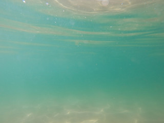 Underwater view from garbage and plastic bottles