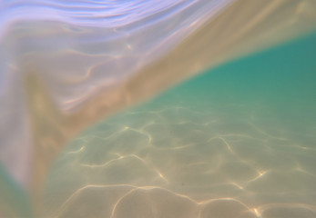 Underwater view from garbage and plastic bottles