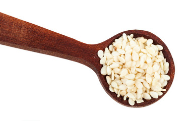 top view of spoon with white sesame seeds close-up