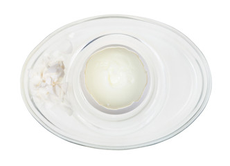 top view of peeled boiled egg in glass egg cup