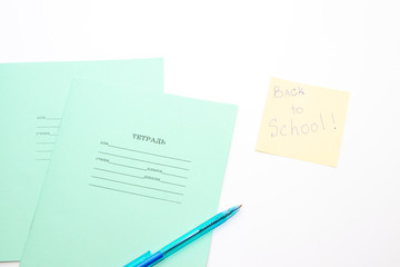 School theme. Preparing for school .Color school supplies isolated on white background. Study . School notebook on a white background