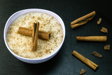Creamy porridge made of rice and condensed milk, a Brazilian dessert common in the states of Minas Gerais. Gastronomic tourism of Brazil.