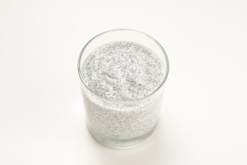 Chia pudding  in glass on a white background. Space for text or design.