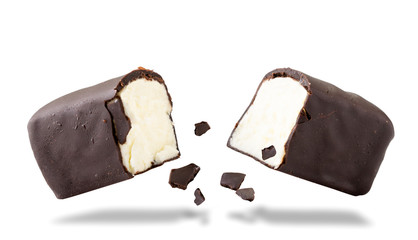 Glazed curd broken in half flying through the air on a white. Isolated