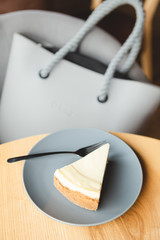 a slice of cheesecake prepared according to the classic recipe: made of shortbread cookies, butter,...