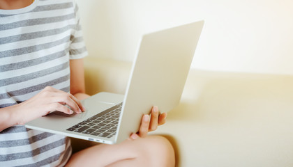 Women hands typing on laptop keyboard. Working or shopping online concept.