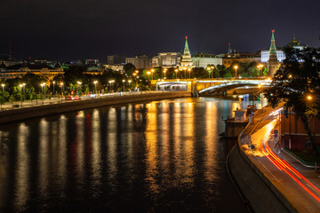 Fototapeta na wymiar Night view to the Moscow river, Kremlin, Vodovoznaya and Borovitskaya towers from the Patriarshiy bridge