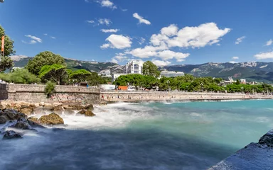 Foto op Canvas Quay of Yalta on the long exposure on the background mountains and blue sky 3 © kirillk