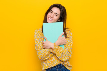 Young caucasian woman holding some notebooks