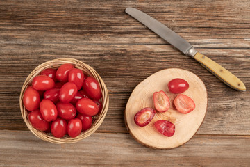 fresh and ripe cranberry fruits on wooden table