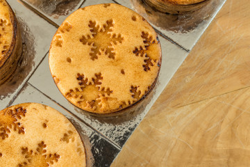 closeup view christmas mini cakes on wooden board