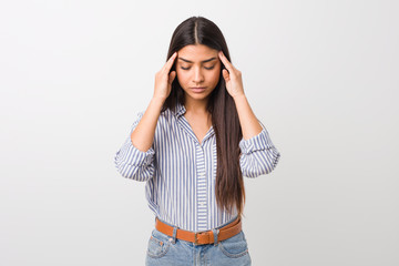 Young pretty arab woman touching temples and having headache.