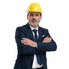Casual engineer wearing a hardhat and blue suit
