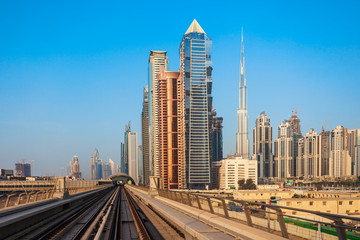 Fototapeta na wymiar Dubai Metro and city skyline, UAE