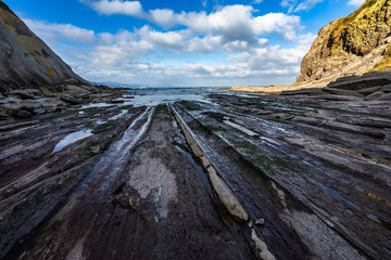 Geological rock formations know as flysch caused by the erosion of the sea, Zumaia, Basque Country, Spain