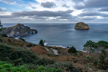 Panoramic view of San Juan de Gaztelugatxe and Aketx (Aquech) island in Atlantic Ocean, Bermeo, Basque Country, Spain