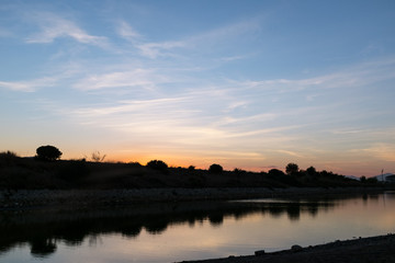 Obraz premium sunset at the mouth of the Guadalmedina river in malaga
