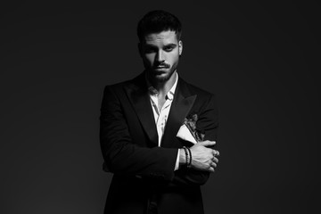 black and white portrait of a sexy  man in tuxedo