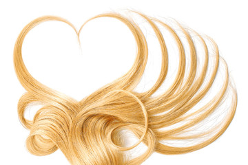 Blond hair in shape of heart isolated on a white background