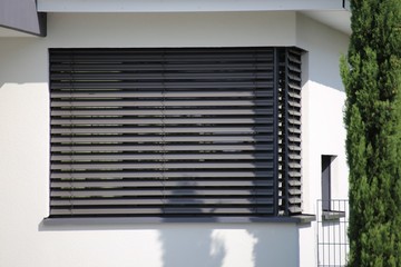 Window with modern blind, exterior shot