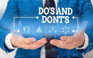 Conceptual hand writing showing Do S And Dont S. Concept meaning Rules or customs concerning some...