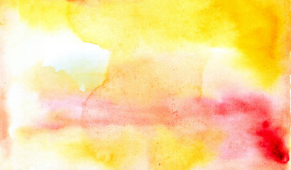 Obraz na płótnie Canvas Beautiful abstract smudges of yellow white and red colors in hand painted watercolor background design