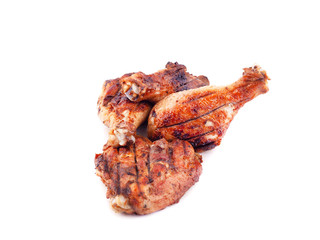 grilled chicken legs with crust on a white background.