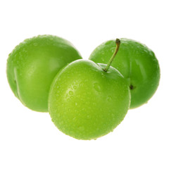 heap of green  cherry-plum isolated on white background