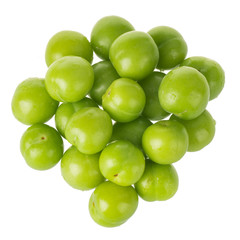 heap of green  cherry-plum isolated on white background