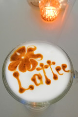 Coffee mug with inscription on foam latte.