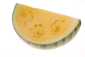slice of yellow watermrlon isolated on white background