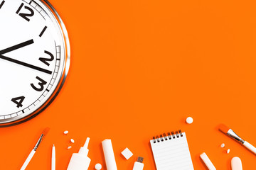 Part of analogue plain wall clock on trendy orange background with white stationery items. One...