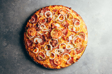 Flat lay of delicious pizza on gray background