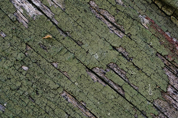 Old peeling paint on a wooden surface. retro wall background.