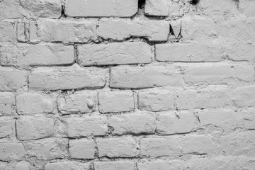 White brick wall up close. Textured grey background