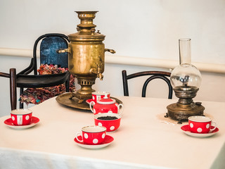 exposition in the museum of the Cossacks: attributes for tea drinking - an old copper samovar and...
