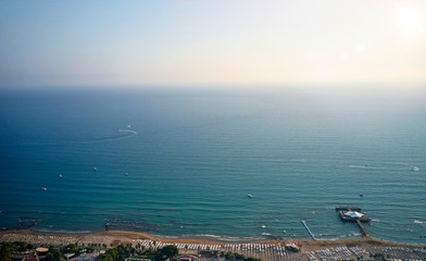drone view of the beach with sun loungers