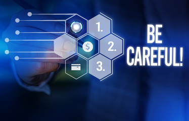 Handwriting text Be Careful. Conceptual photo making sure of avoiding potential danger mishap or harm Male human wear formal work suit presenting presentation using smart device