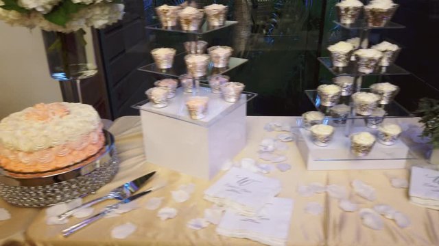 Wedding sweet treats on a beige tablecloth. Wedding dessert 4k