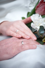Loving couple holding hands with rings. happy wedding day
