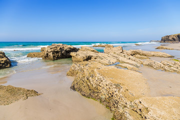 Ribadeo, Spain. Coastal stones on the beach of Holy Water (Praia de Augas Santas)