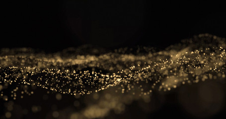 Gold glitter light particles splash wave, golden glittering glow sparks with bokeh on black background, overlay effect