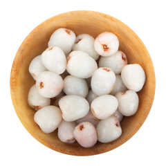 heap of peeled lychees isolated on white background in wooden plate