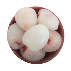 heap of peeled lychees isolated on white background in wooden plate. top view