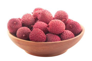 heap of lychees with rind isolated on white background in wooden plate