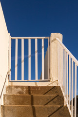 Naklejka premium Stairs outdoors and a bright blue sky