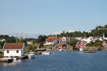 Fototapeta na wymiar Houses and boats in Kristiansand, Norway